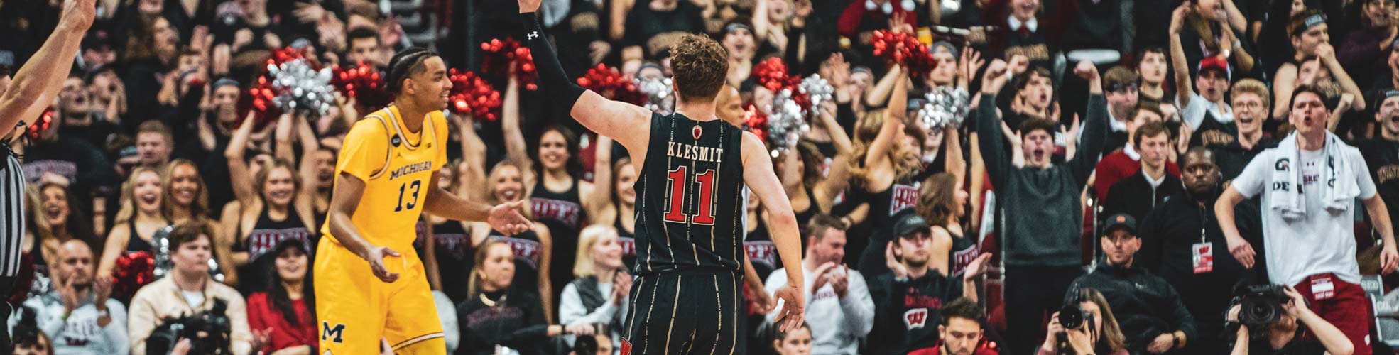 A close-up action shot of a UW-Madison Men's Basketball game