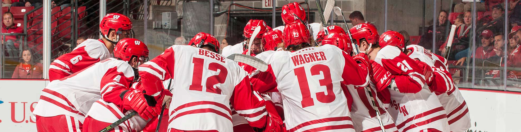 A close-up huddle shot of a UW-Madison Men's Hockey game